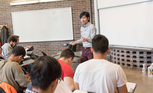 male professor teaching students